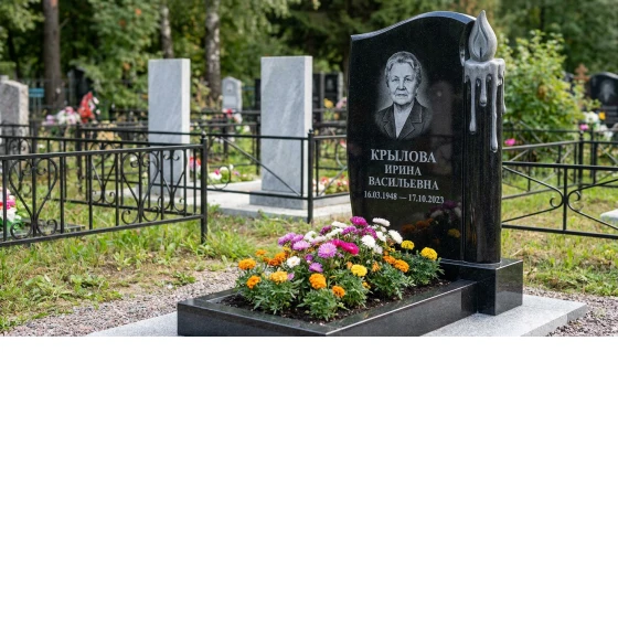 Памятник с зажженной свечой из черного габбро-диабаза с восковыми подтеками