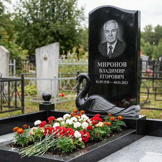 Памятник с лебедем из габбро-диабаза с портретом